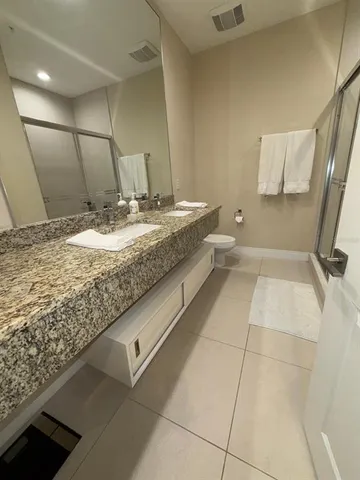 a bedroom with a bed and a walk in closet