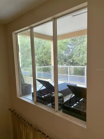 a living room with large windows