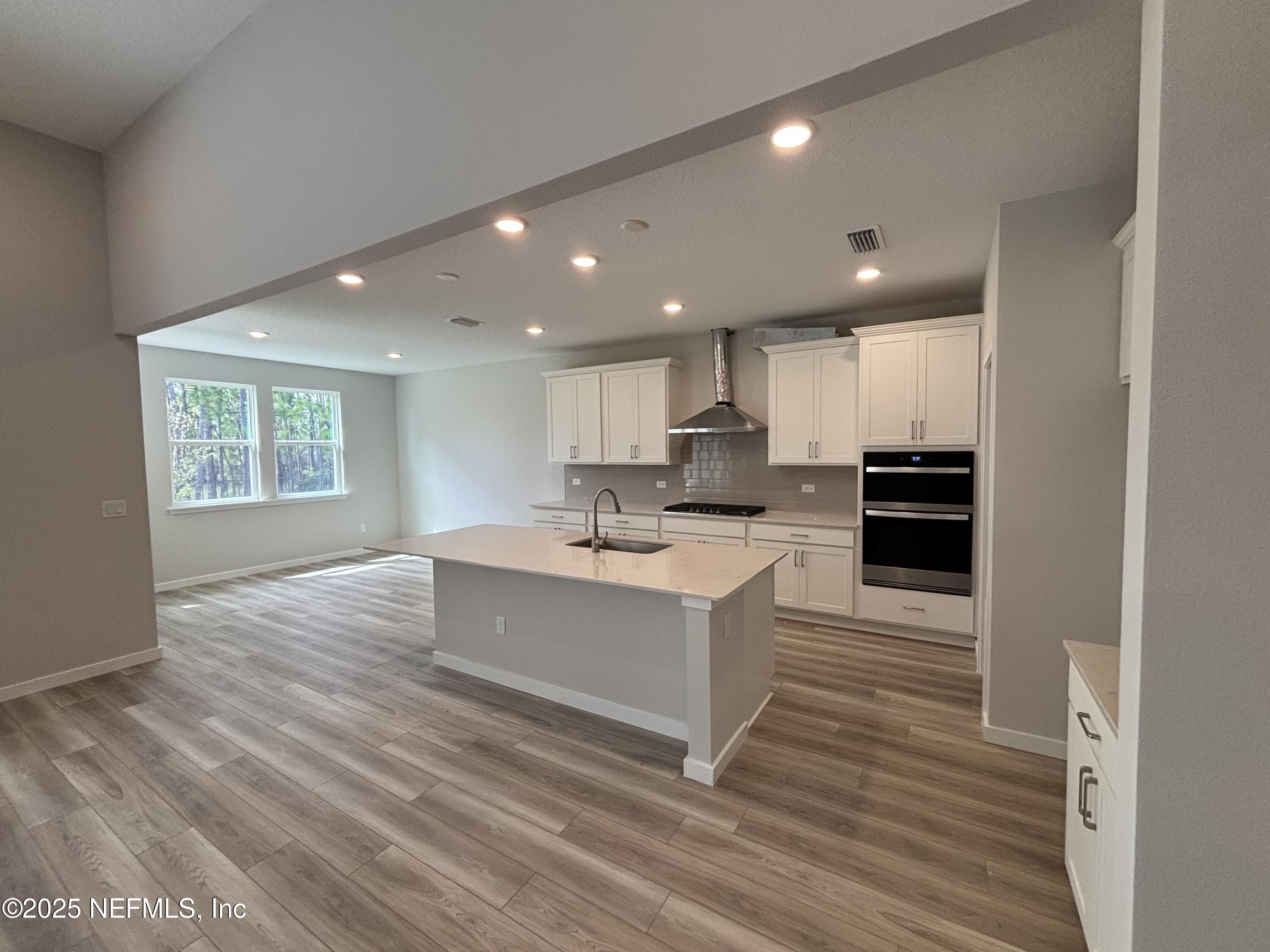 67 Pegasus Road Flagler Beach, FL 32136 - Photo 16 of 34 a view of kitchen with cabinets microwave and stove