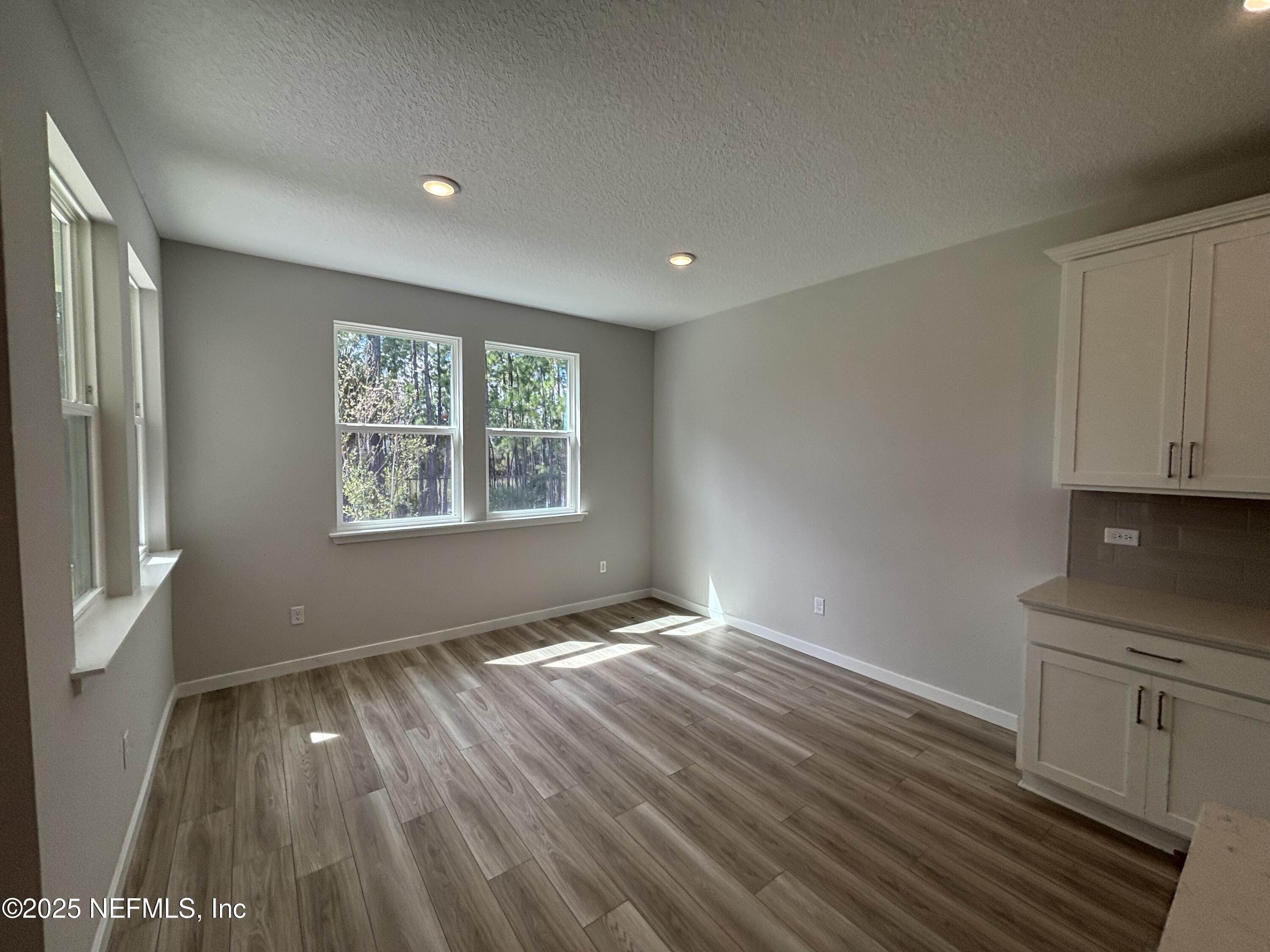 67 Pegasus Road Flagler Beach, FL 32136 - Photo 19 of 34 a view of hallway with window and wooden floor