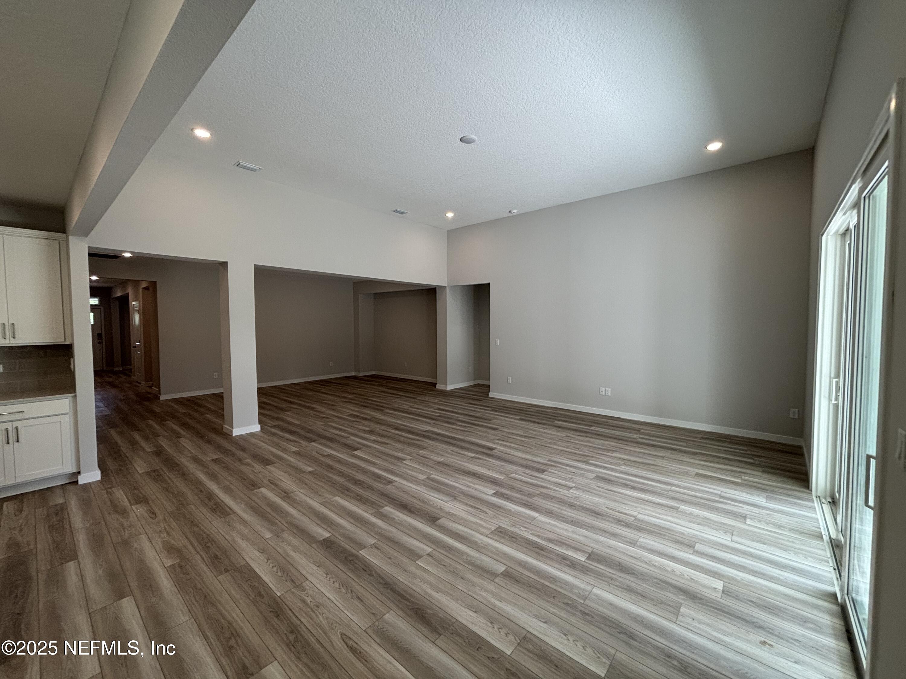67 Pegasus Road Flagler Beach, FL 32136 - Photo 21 of 34 a view of an empty room with wooden floor
