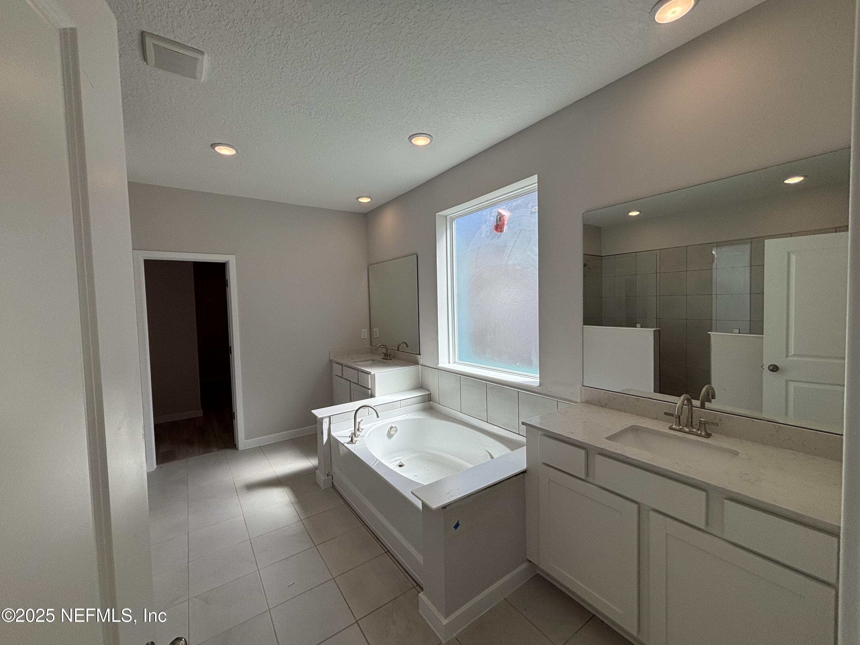 67 Pegasus Road Flagler Beach, FL 32136 - Photo 25 of 34 a bathroom with a sink and a mirror