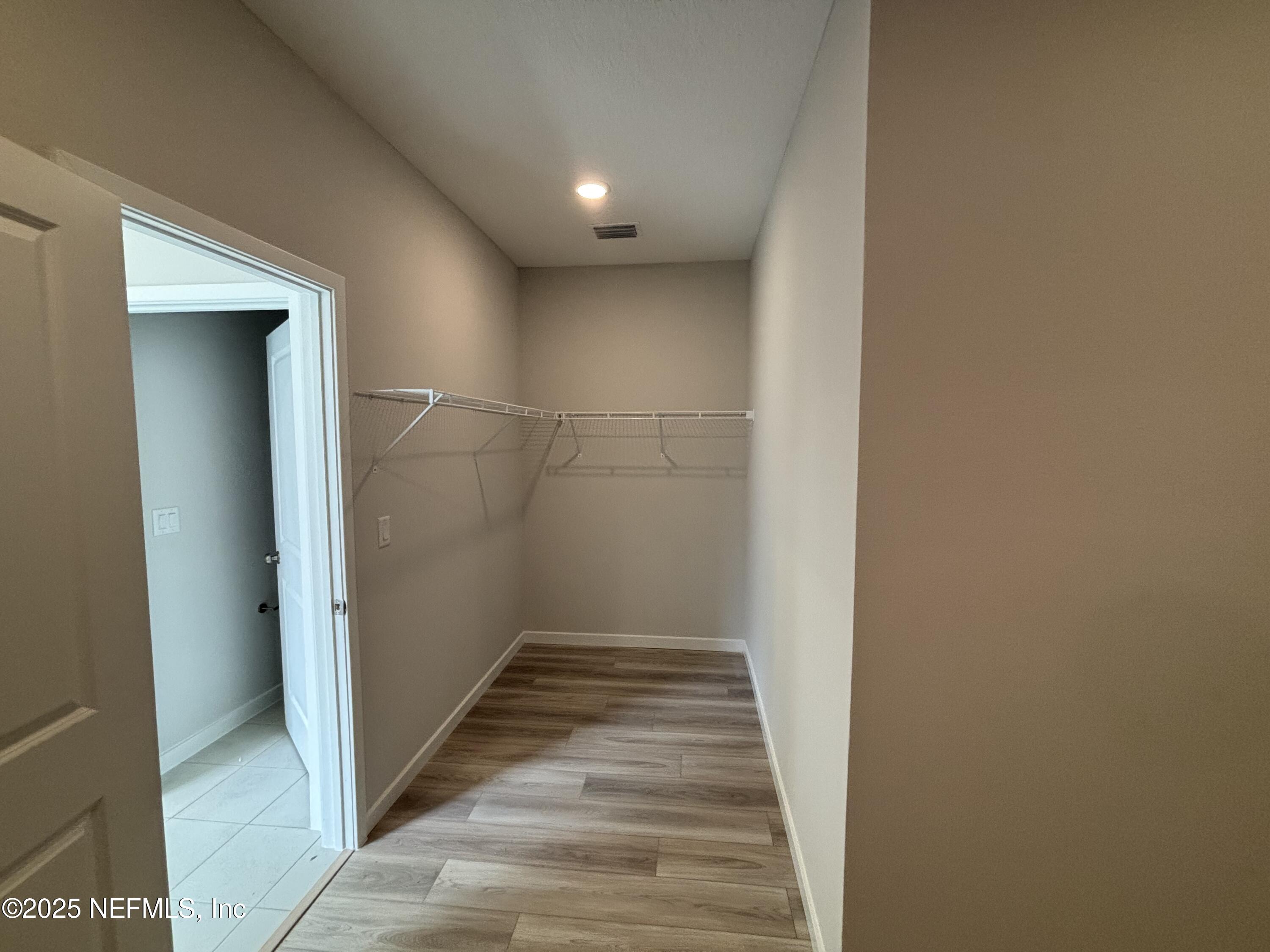 67 Pegasus Road Flagler Beach, FL 32136 - Photo 28 of 34 a view of a hallway with wooden floor and staircase