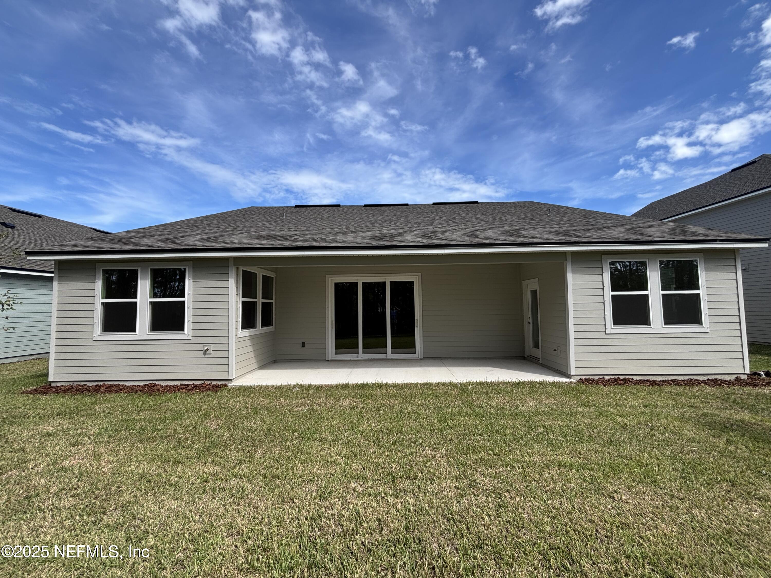 67 Pegasus Road Flagler Beach, FL 32136 - Photo 32 of 34 a front view of a house with yard