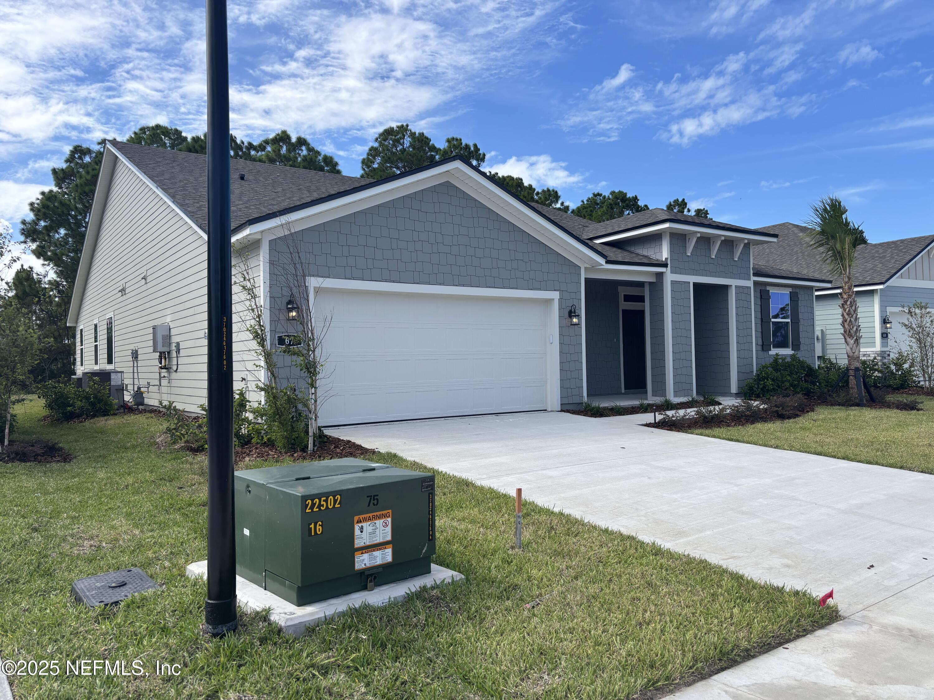 67 Pegasus Road Flagler Beach, FL 32136 - Photo 4 of 34 a front view of a house with garden