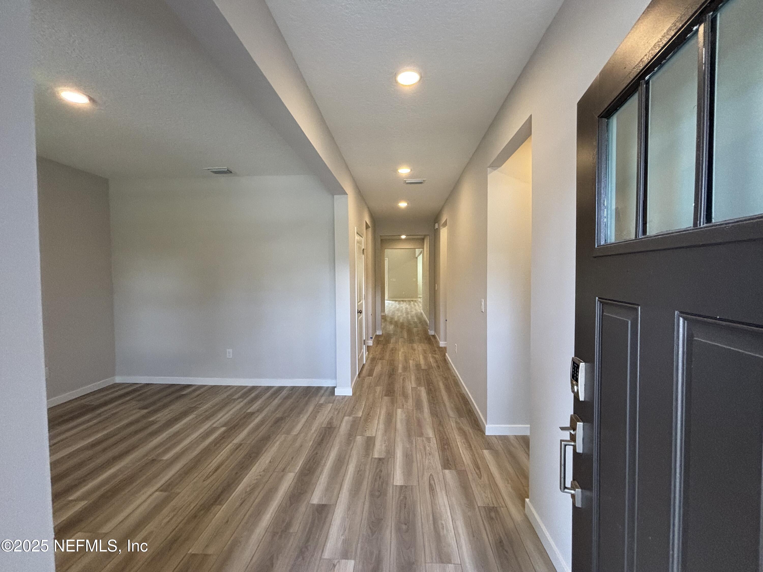 67 Pegasus Road Flagler Beach, FL 32136 - Photo 7 of 34 a view of a hallway with wooden floor