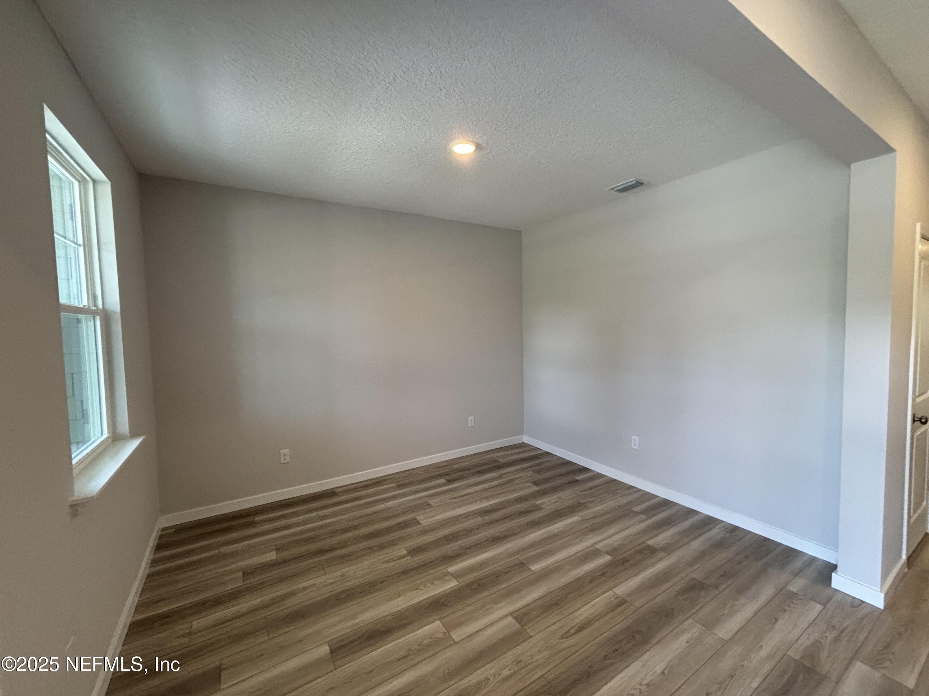 67 Pegasus Road Flagler Beach, FL 32136 - Photo 8 of 34 wooden floor in an empty room