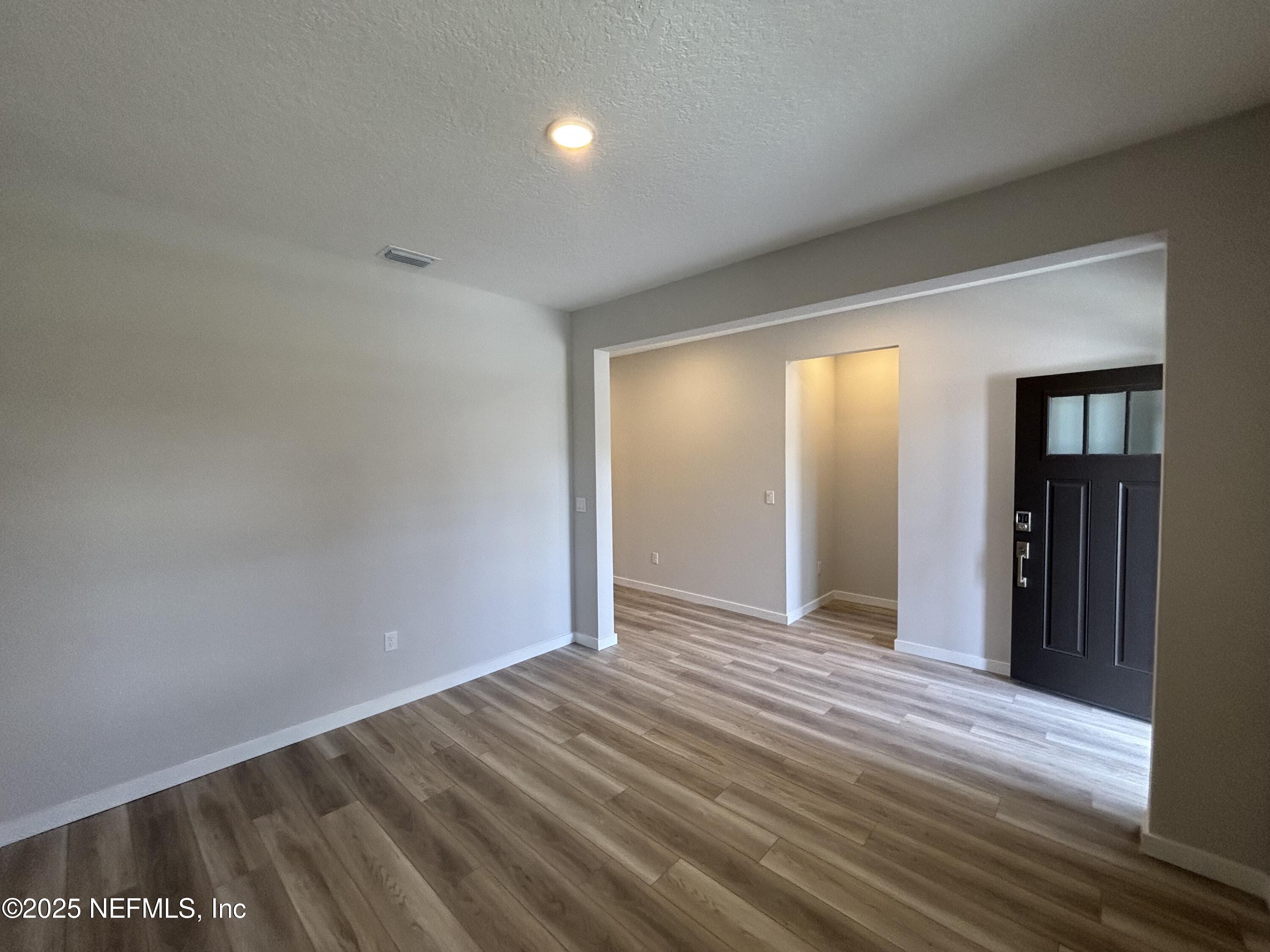 67 Pegasus Road Flagler Beach, FL 32136 - Photo 9 of 34 an empty room with closet and windows