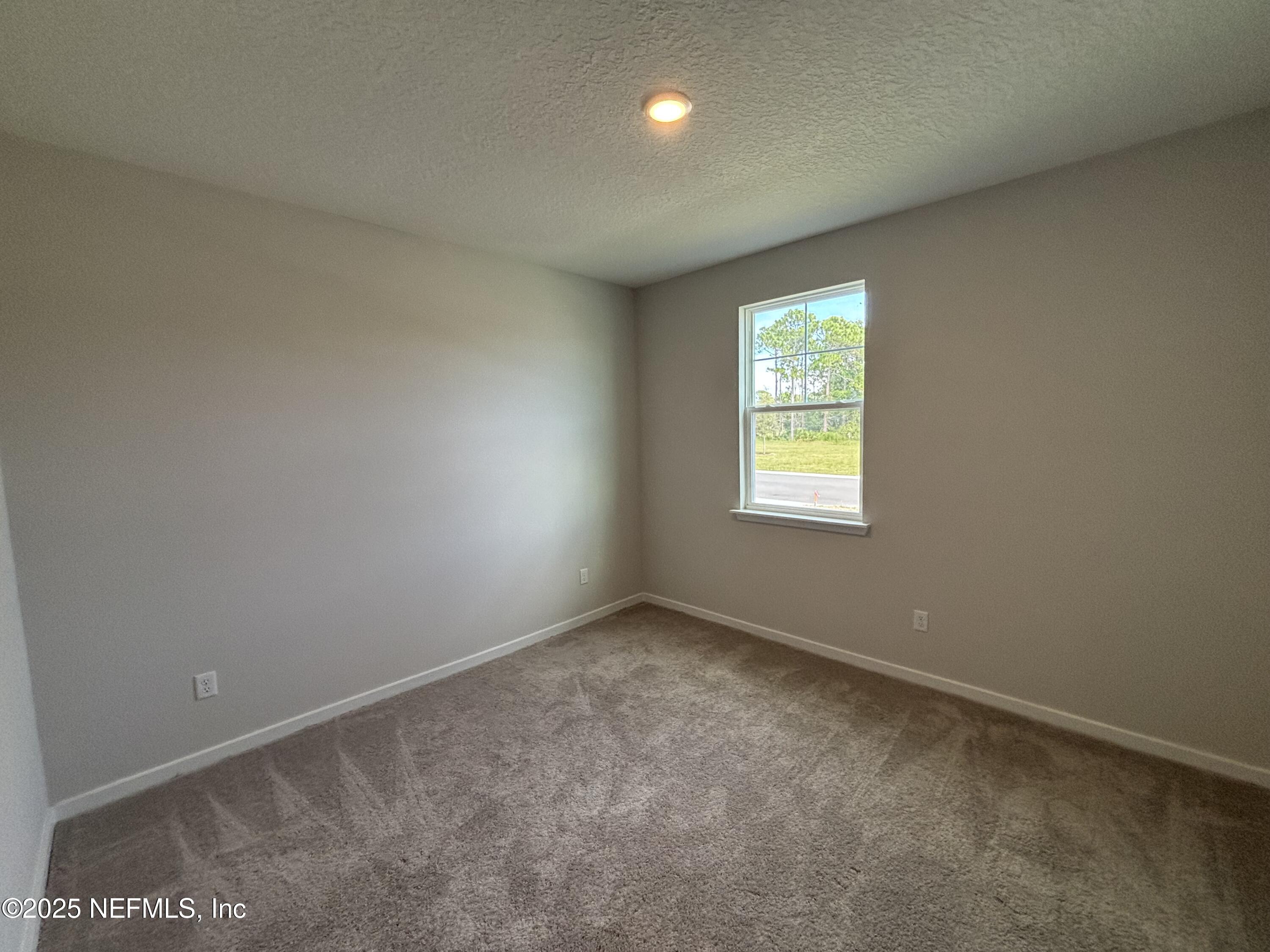 67 Pegasus Road Flagler Beach, FL 32136 - Photo 10 of 34 an empty room with windows