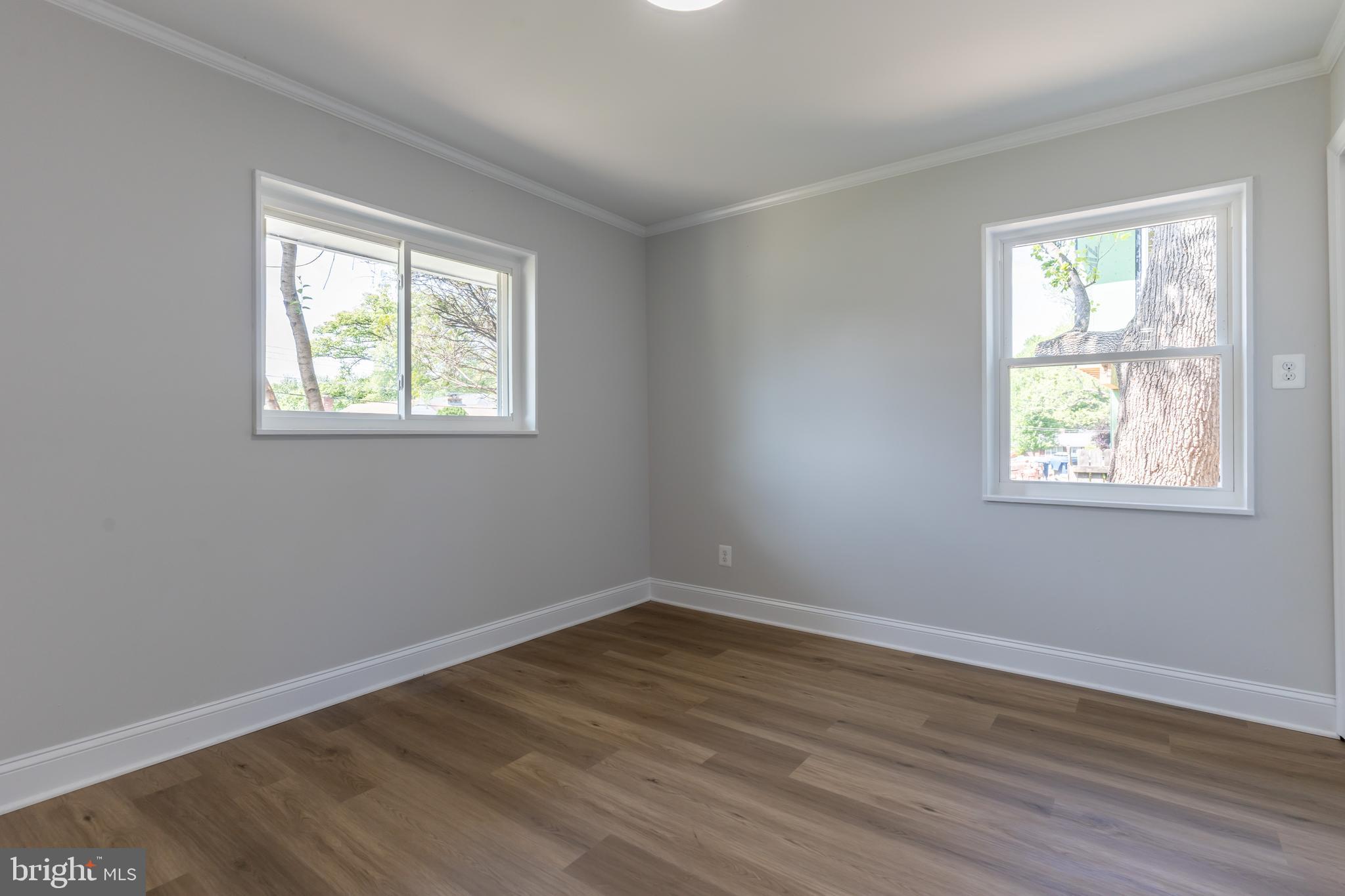 5506 Joplin Street Springfield, VA 22151 - Photo 15 of 32 a view of an empty room with wooden floor and a window