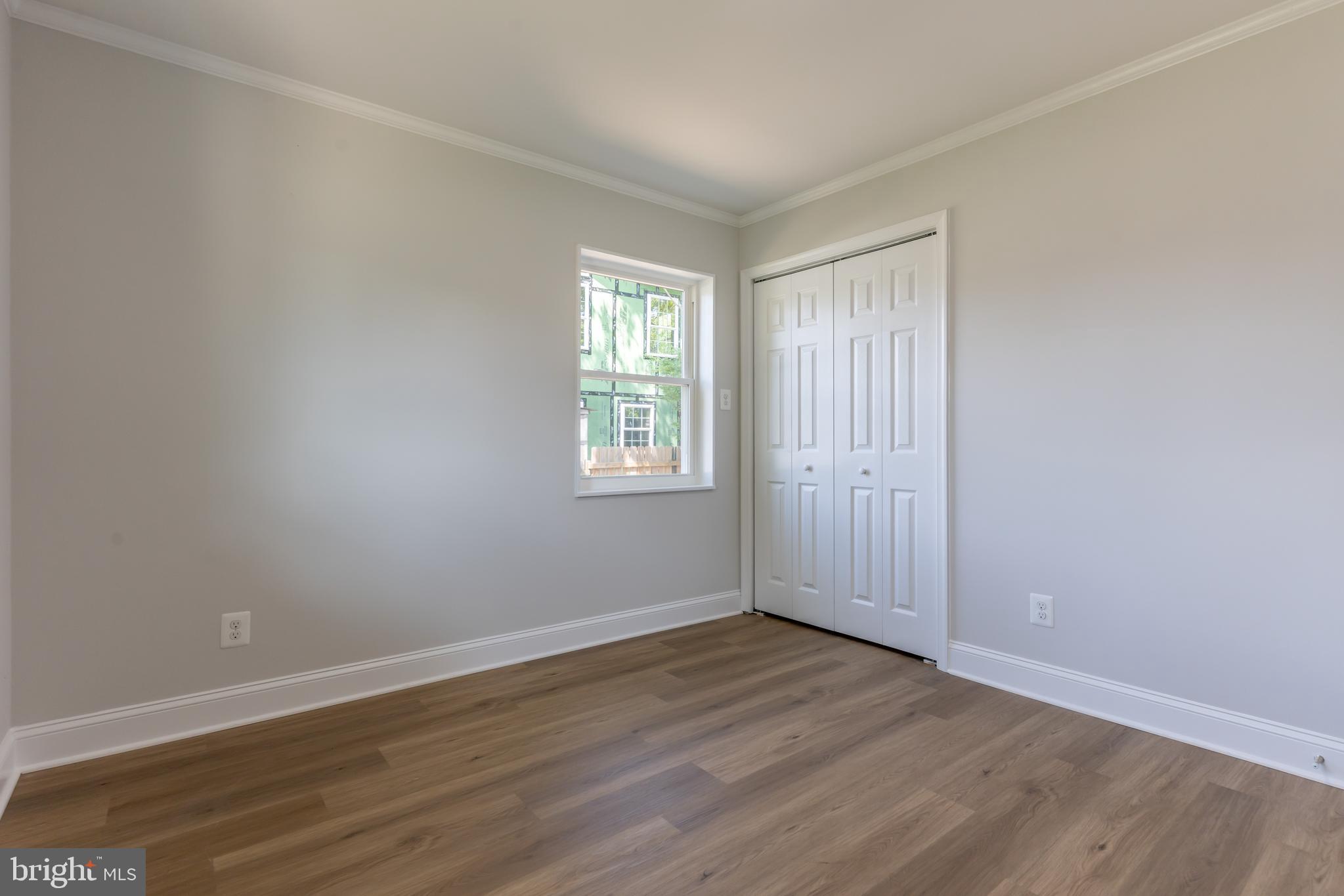 5506 Joplin Street Springfield, VA 22151 - Photo 16 of 32 an empty room with wooden floor and windows