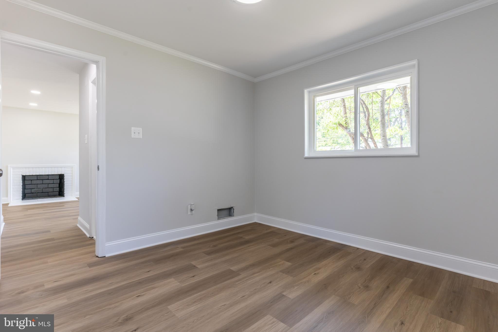 5506 Joplin Street Springfield, VA 22151 - Photo 17 of 32 an empty room with wooden floor and windows