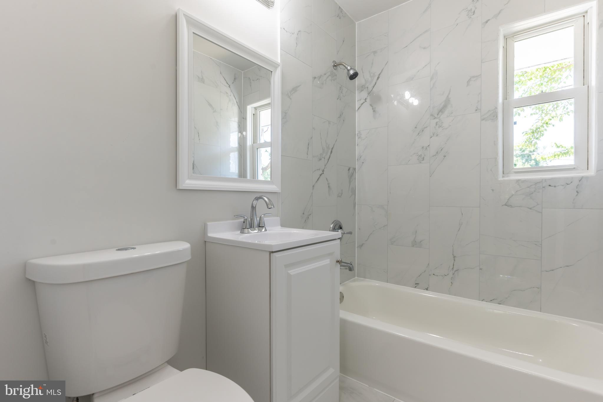 5506 Joplin Street Springfield, VA 22151 - Photo 18 of 32 a bathroom with a sink toilet and bathtub