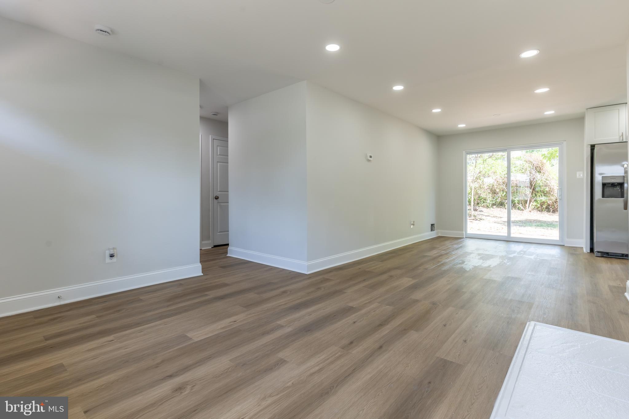 5506 Joplin Street Springfield, VA 22151 - Photo 21 of 32 an empty room with wooden floor and windows