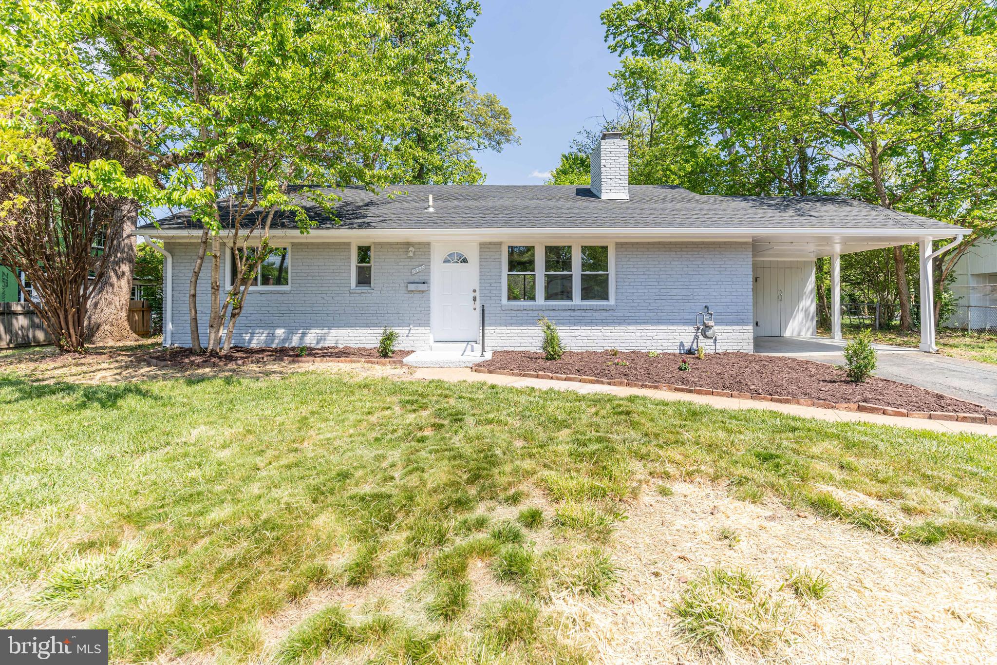 5506 Joplin Street Springfield, VA 22151 - Photo 26 of 32 a front view of house with yard outdoor seating and barbeque oven