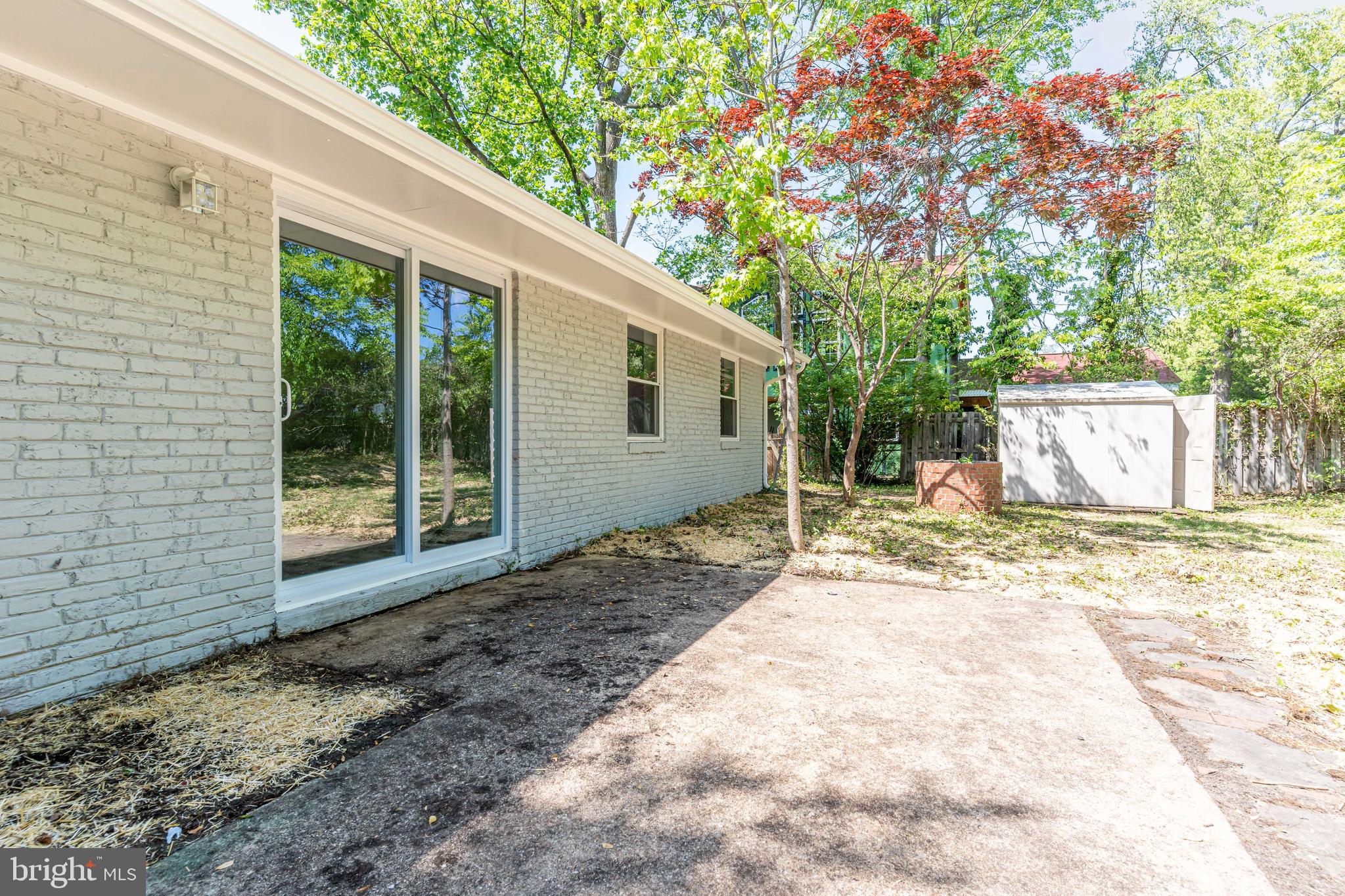 5506 Joplin Street Springfield, VA 22151 - Photo 28 of 32 a view of a house with a backyard and a tree