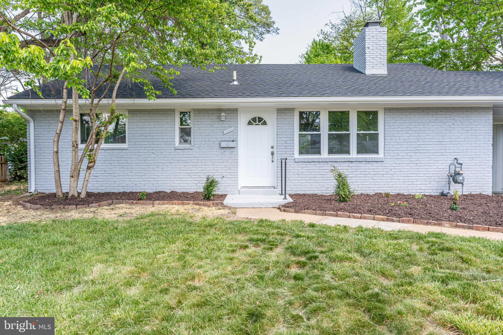 5506 Joplin Street Springfield, VA 22151 - Photo 32 of 32 a front view of a house with a yard and garage