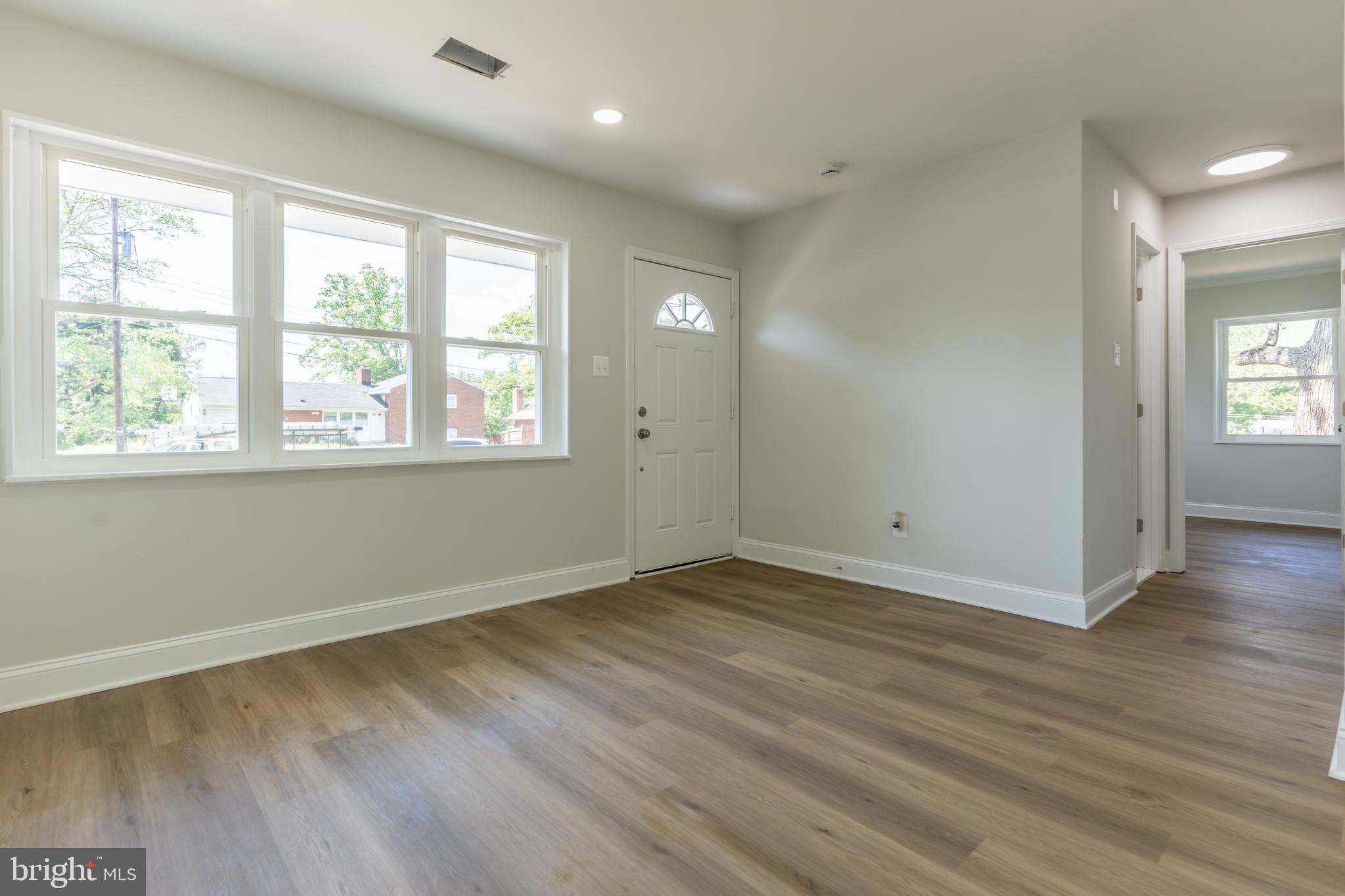 5506 Joplin Street Springfield, VA 22151 - Photo 4 of 32 an empty room with wooden floor and windows
