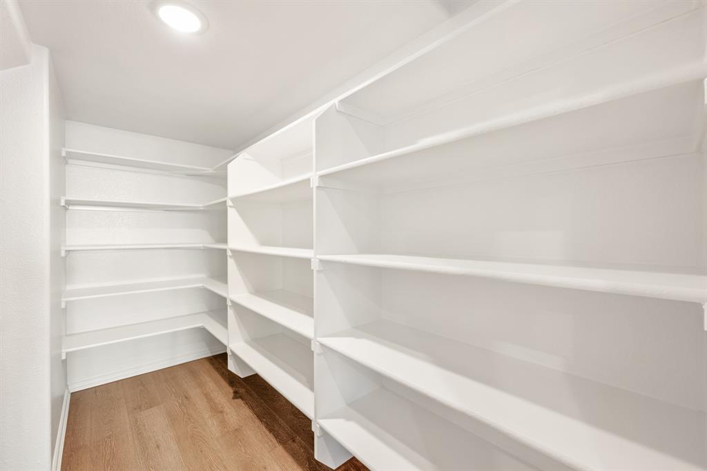 14422 McClint Street Pilot Point, TX 76258 - Photo 12 of 40 a view of walk in closet with empty racks