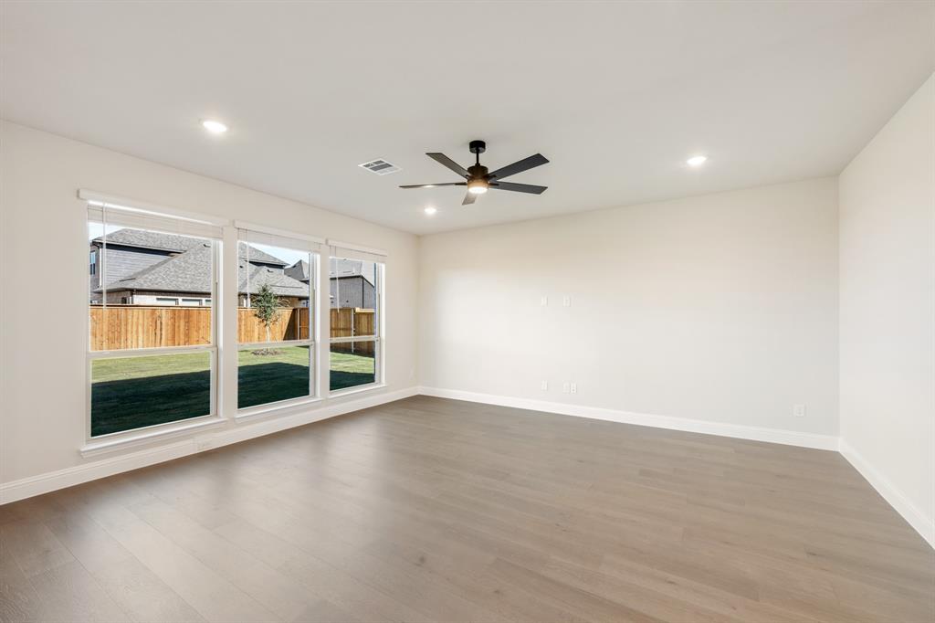 14422 McClint Street Pilot Point, TX 76258 - Photo 18 of 40 an empty room with windows and ceiling fan