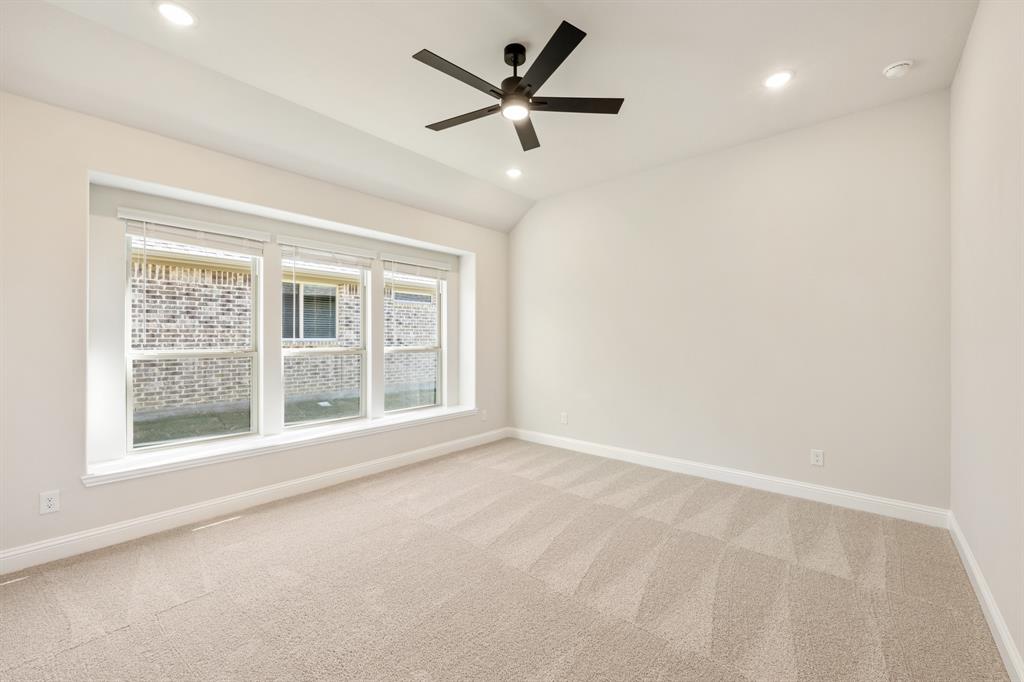 14422 McClint Street Pilot Point, TX 76258 - Photo 20 of 40 an empty room with a window and a ceiling fan