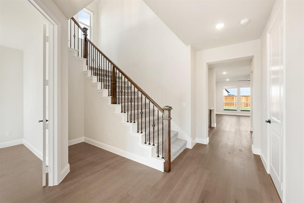 14422 McClint Street Pilot Point, TX 76258 - Photo 24 of 40 a view of a hallway with wooden floor and entryway