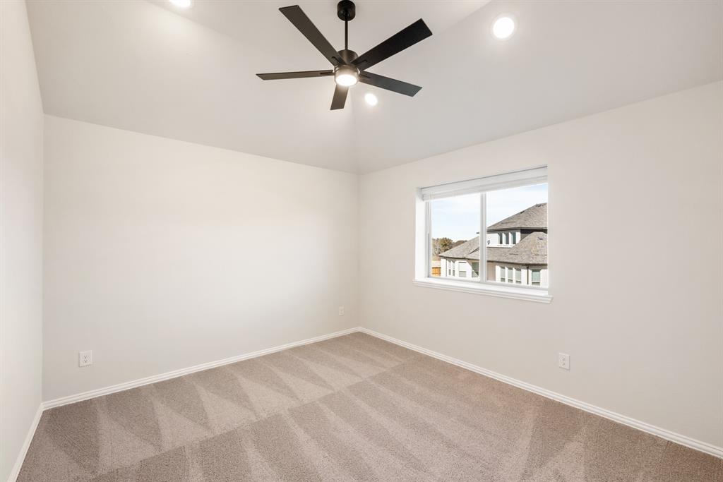 14422 McClint Street Pilot Point, TX 76258 - Photo 33 of 40 an empty room with a window and a fan