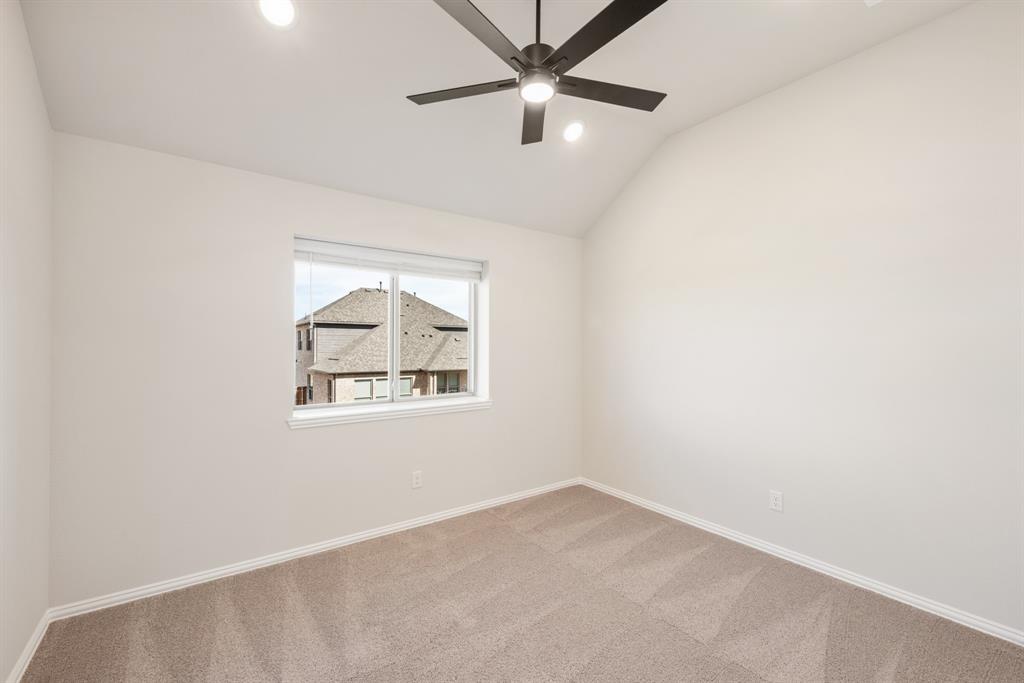 14422 McClint Street Pilot Point, TX 76258 - Photo 34 of 40 an empty room with a window and a ceiling fan