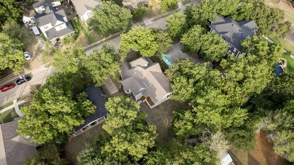 an aerial view of a house with yard