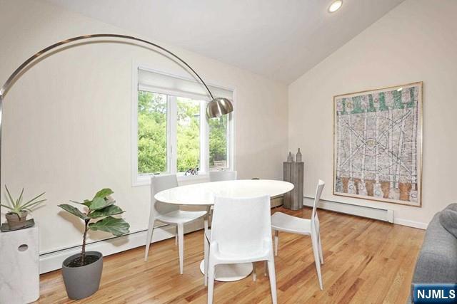 84 12th Street Cresskill, NJ 07626 - Photo 13 of 45 a dining room with furniture potted plants and wooden floor