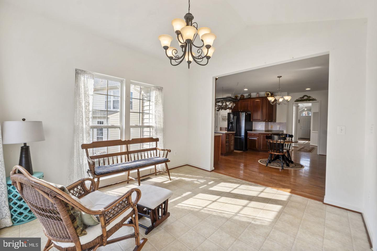 6528 Atkins Way Gainesville, VA 20155 - Photo 16 of 42 a view of a livingroom with furniture and a chandelier