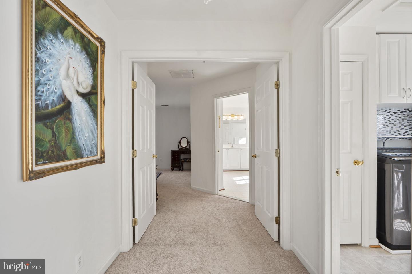 6528 Atkins Way Gainesville, VA 20155 - Photo 20 of 42 a view of a hallway with wooden shelves