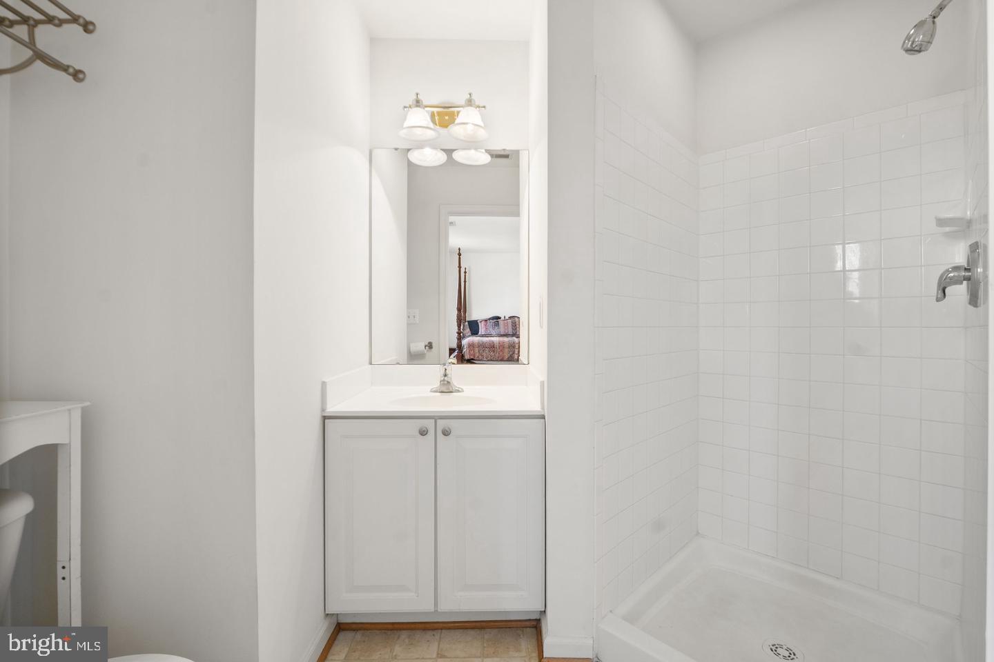 6528 Atkins Way Gainesville, VA 20155 - Photo 29 of 42 a bathroom with a sink and a mirror