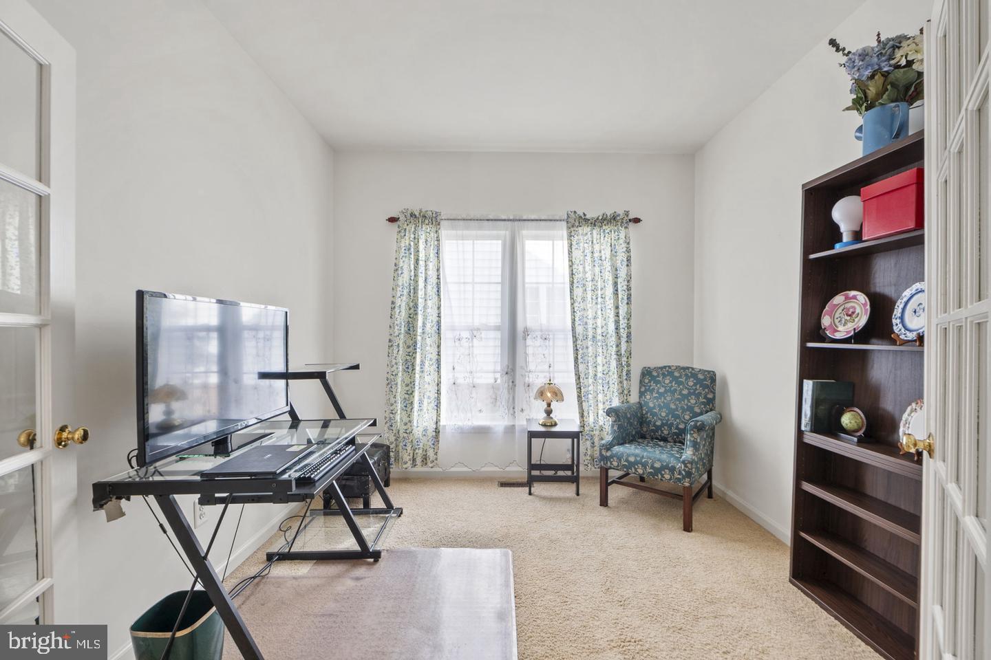 6528 Atkins Way Gainesville, VA 20155 - Photo 7 of 42 a living room with furniture and floor to ceiling window