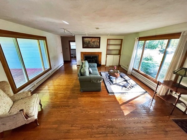 679 Westhampton Road Northampton, MA 01062 - Photo 3 of 11 a living room with fireplace furniture and a large window