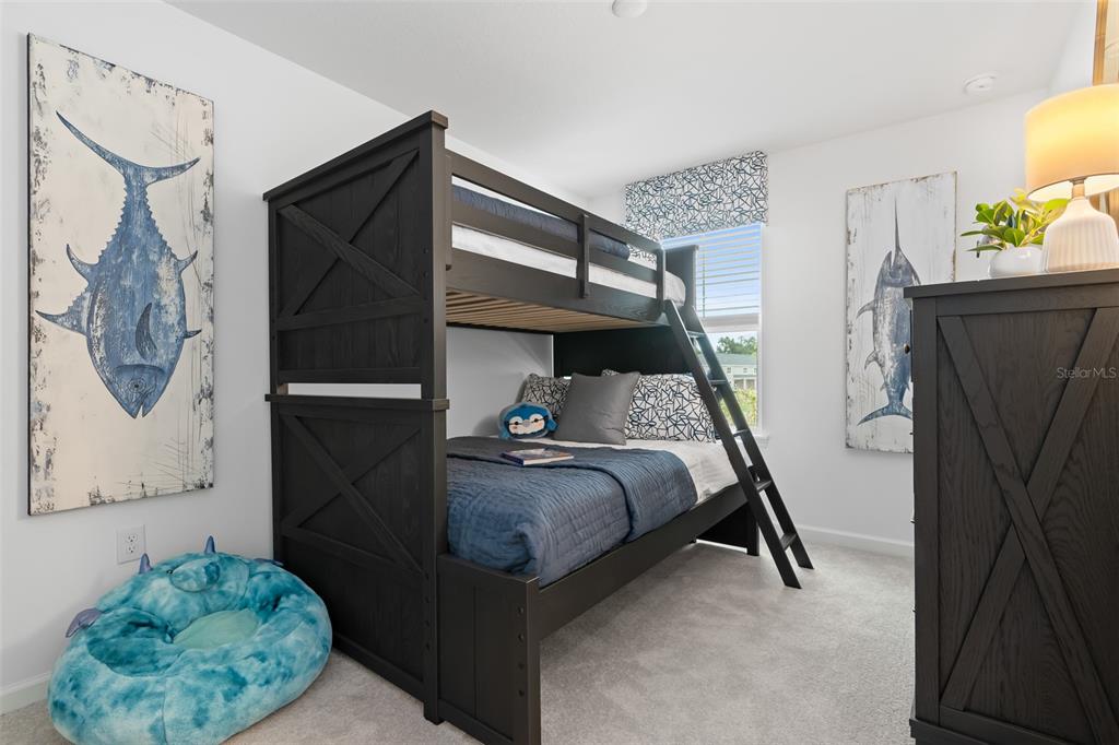 3639 Southeast 37th Ave Road Ocala, FL 34480 - Photo 12 of 61 a bedroom with a bed and wooden floor