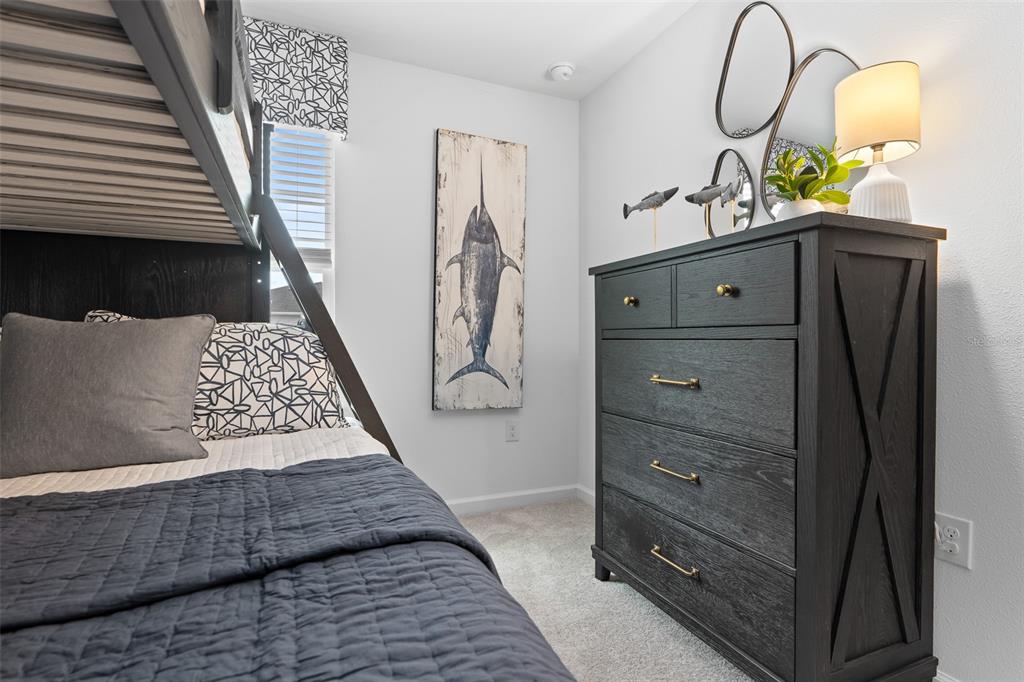 3639 Southeast 37th Ave Road Ocala, FL 34480 - Photo 14 of 61 a bedroom with a bed and a dresser