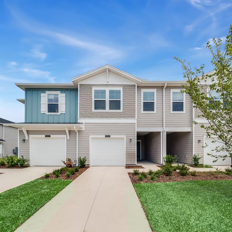 3639 Southeast 37th Ave Road Ocala, FL 34480 - Photo 2 of 61 a front view of a house with a yard and garage