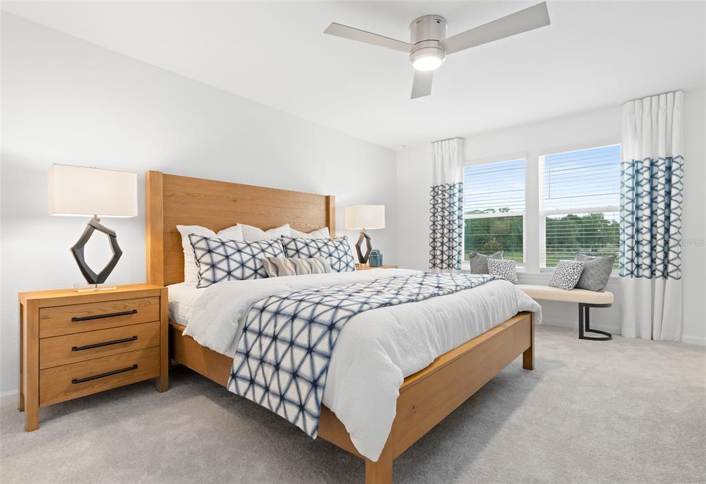 3639 Southeast 37th Ave Road Ocala, FL 34480 - Photo 30 of 61 a spacious bedroom with a bed and window