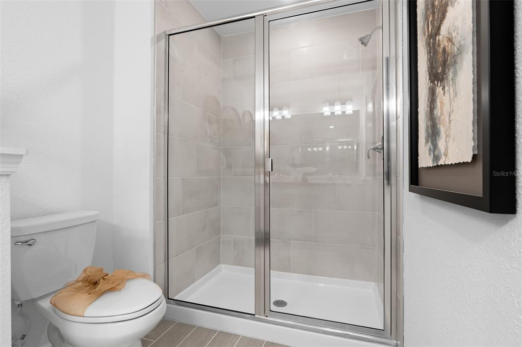 3639 Southeast 37th Ave Road Ocala, FL 34480 - Photo 35 of 61 a bathroom that has a glass shower door