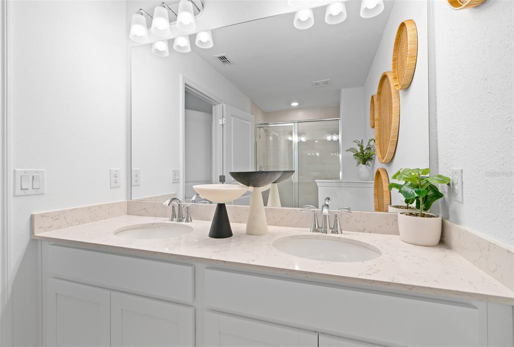 3639 Southeast 37th Ave Road Ocala, FL 34480 - Photo 36 of 61 a bathroom with a sink a mirror and a potted plant