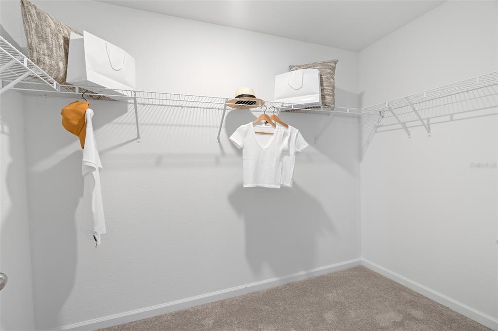 3639 Southeast 37th Ave Road Ocala, FL 34480 - Photo 37 of 61 a view of storage and utility room with racks on the wall