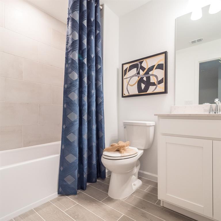 3639 Southeast 37th Ave Road Ocala, FL 34480 - Photo 50 of 61 a bathroom with a toilet sink and mirror