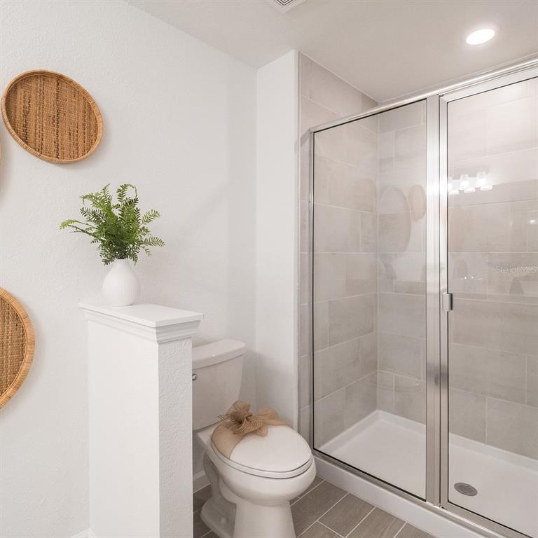 3639 Southeast 37th Ave Road Ocala, FL 34480 - Photo 61 of 61 a bathroom with a shower a toilet and a sink