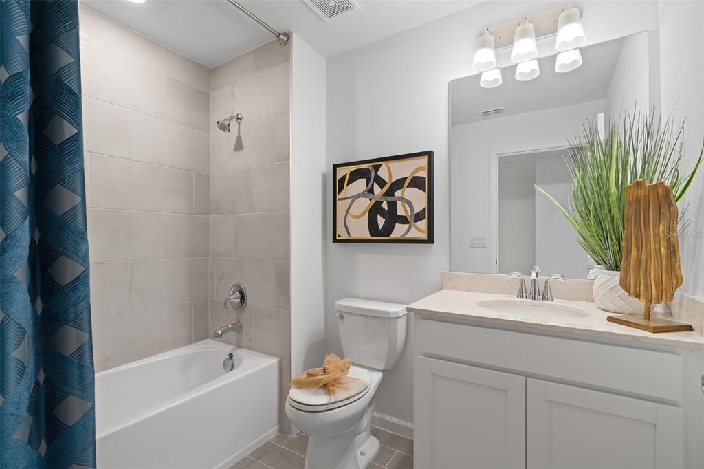 3639 Southeast 37th Ave Road Ocala, FL 34480 - Photo 8 of 61 a bathroom with a bathtub a sink and a large mirror