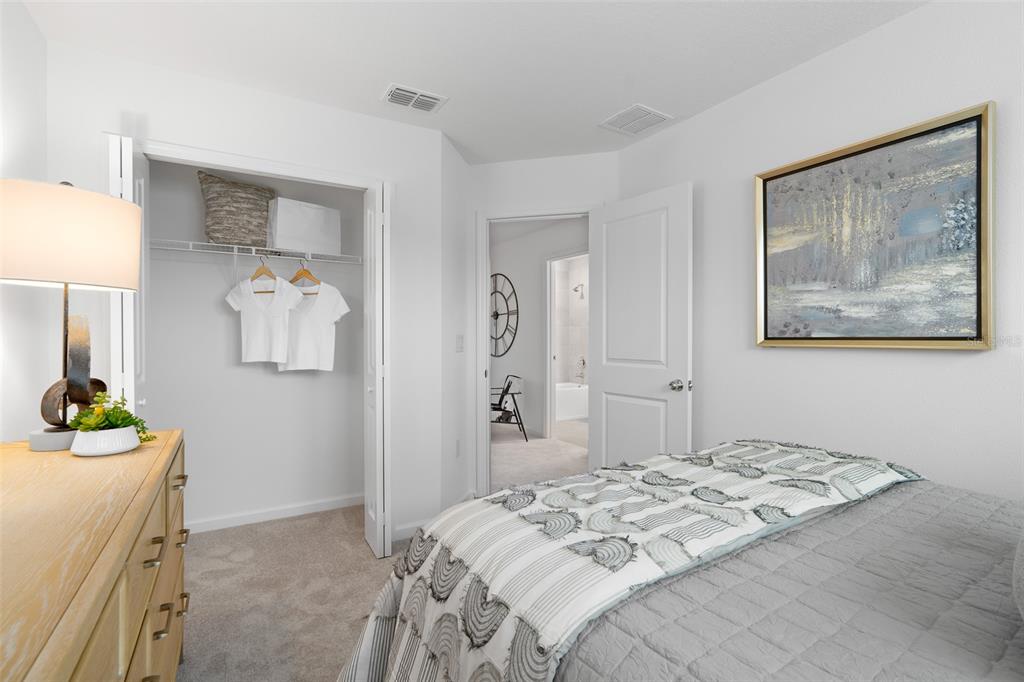 3639 Southeast 37th Ave Road Ocala, FL 34480 - Photo 10 of 61 a bedroom with a bed and a mirror