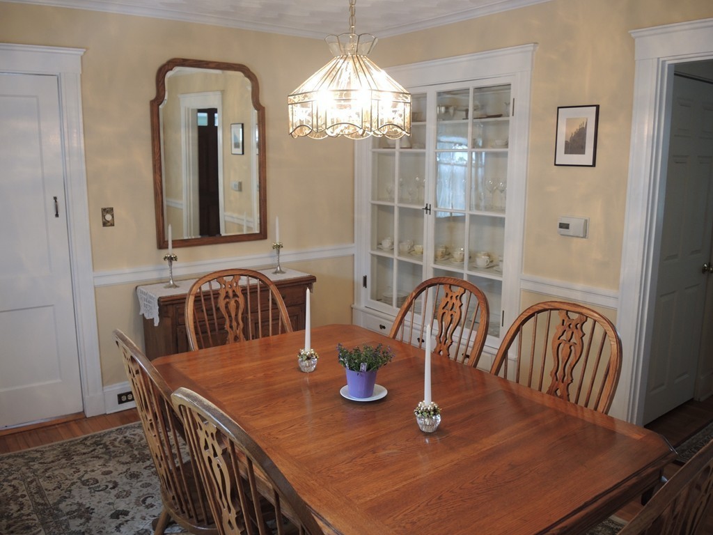 21 Lawton Road Needham, MA 02492 - Photo 11 of 28 a view of a dining room with furniture window and wooden floor