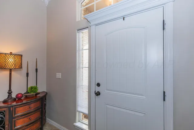 a view of an entryway with wooden floor