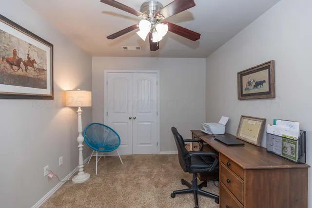 a view of a workspace with furniture