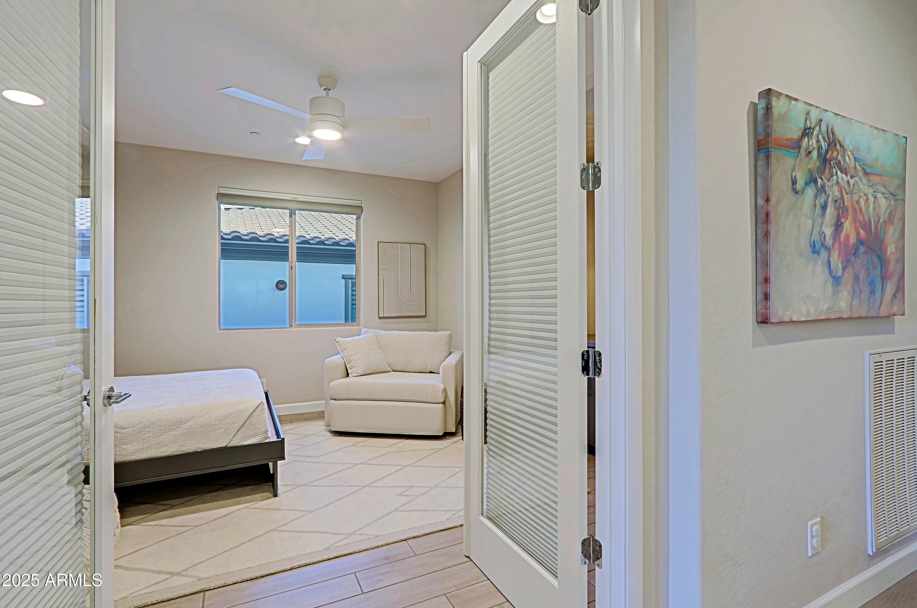 17811 East Cindercone Road Rio Verde, AZ 85263 - Photo 11 of 32 a bedroom with a bed and a painting on the wall